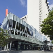 Exterior view of the building's entrance - Exterior architecture, brutalist architecture, building, commercial building, condominium, corporate headquarters, daytime, downtown, facade, headquarters, landmark, metropolis, metropolitan area, mixed use, skyscraper, skyway, structure, tower block