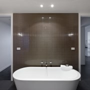 View of this contemporary apartment - View of architecture, bathroom, bathtub, ceiling, daylighting, floor, glass, interior design, plumbing fixture, product design, room, tile, wall, window, gray, black