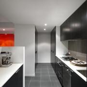 View of this contemporary apartment - View of architecture, ceiling, countertop, interior design, kitchen, product design, room, gray, black