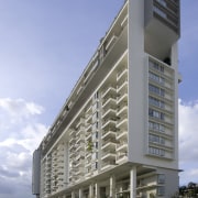 Exterior view of the building - Exterior view apartment, architecture, brutalist architecture, building, commercial building, condominium, corporate headquarters, daytime, elevation, facade, headquarters, metropolitan area, mixed use, real estate, residential area, sky, tower block, teal, gray