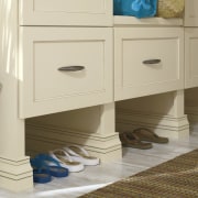 View of a bedroom which features cabinetry from cabinetry, chest of drawers, drawer, floor, flooring, furniture, product, product design, sideboard, wood stain, orange, brown