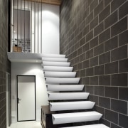 View of cantilevered, triangular-shaped steel stairs, tiled floors, architecture, ceiling, daylighting, floor, flooring, handrail, home, house, interior design, lobby, loft, stairs, wall, black, white