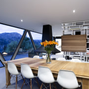 View of dining area featuring steel trusses, shelving, apartment, architecture, house, interior design, living room, penthouse apartment, real estate, table, gray