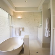 View of contemporary light-toned bathroom off bedroom with architecture, bathroom, ceiling, daylighting, estate, floor, flooring, home, house, interior design, property, real estate, room, sink, tile, gray