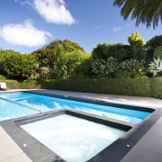 Exterior view of an outdoor area which features cloud, estate, house, leisure, plant, property, real estate, reflection, resort, sky, swimming pool, tree, vacation, water