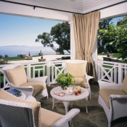 Exterior sun room for relaxing &amp; hanging out balcony, estate, home, interior design, outdoor structure, patio, property, real estate, resort, table