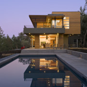 Designed by Robert Swatt, FAIA, Swatt | Miers architecture, elevation, estate, facade, family car, home, house, lighting, property, real estate, reflection, residential area, sky, swimming pool, villa, blue