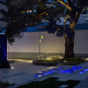 View of the St Patrick's Square where the architecture, city, darkness, evening, landscape lighting, light, lighting, metropolitan area, night, plant, reflection, sky, tree, urban area, water, black
