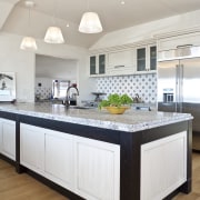 Close-up view of main kitchen area with large cabinetry, countertop, cuisine classique, floor, home, interior design, kitchen, room, white