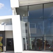 Exterior view of the Lion Nathan brewhouse which architecture, building, commercial building, corporate headquarters, door, facade, glass, house, property, real estate, window, white