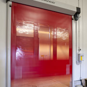 View of the Lion Nathan storage warehouse which door, red, gray, red