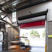 View of the Lion Nathan storage warehouse which gray, white, black