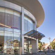 Entrance of the Ferrari Showroom - Entrance of apartment, architecture, building, commercial building, corporate headquarters, facade, mixed use, real estate, residential area, gray