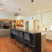 Warm colours featured in this traditional kitchen - cabinetry, countertop, floor, flooring, hardwood, interior design, kitchen, laminate flooring, property, real estate, room, wood flooring, white, orange