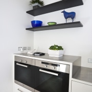 Modern kitchen features brilliant white panelling - Modern furniture, home appliance, interior design, kitchen, kitchen stove, product, product design, shelf, shelving, white