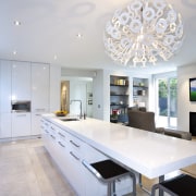 Modern kitchen features brilliant white panelling - Modern ceiling, countertop, daylighting, interior design, kitchen, real estate, table, gray, white