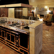 View of a French-style farmhouse kitchen which features countertop, cuisine classique, flooring, interior design, kitchen, room, brown, black