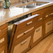 The custom made dishwasher cabinetry - The custom cabinetry, countertop, drawer, floor, flooring, furniture, hardwood, kitchen, laminate flooring, plywood, sink, wood, wood flooring, wood stain, brown, orange