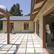 Exterior view of an energy-efficient home which was estate, house, outdoor structure, patio, property, real estate, roof, brown