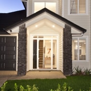 Exterior view of home which features weatherboard cladding, cottage, elevation, estate, facade, home, house, orangery, porch, property, real estate, residential area, siding, window, gray, brown