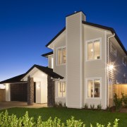 Exterior view of home which features weatherboard cladding, architecture, building, cottage, elevation, estate, facade, farmhouse, home, house, property, real estate, residential area, siding, sky, villa, window, blue