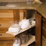 View of the slide-out drawers for kitchen appliances cabinetry, countertop, drawer, furniture, interior design, kitchen, kitchen organizer, table, wood, brown, orange