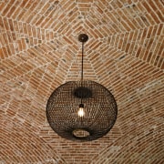 View of hacienda-style house with plastered walls, vaulted wood, brown, orange