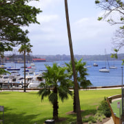 View of Elizabeth Bay from the covered patio. arecales, lake, leisure, palm tree, plant, real estate, recreation, resort, sky, tree, water, teal