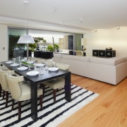 View of open-plan living and dining area which floor, flooring, hardwood, interior design, kitchen, living room, property, real estate, room, wood flooring, gray