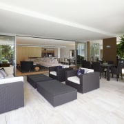 View of a covered patio which features tiled apartment, floor, flooring, interior design, living room, property, real estate, white