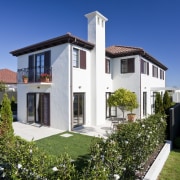 Exterior view of Eden Homes show home which apartment, architecture, building, cottage, elevation, estate, facade, home, house, neighbourhood, property, real estate, residential area, sky, villa, blue