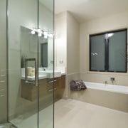 View of the bathroom of this Landmark Homes bathroom, floor, glass, interior design, property, real estate, room, gray