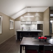 View of the dining and kitchen area of ceiling, countertop, floor, interior design, kitchen, real estate, room, gray, black