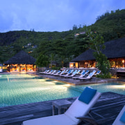 View of Four Seasons Seychelles high-end resort - estate, leisure, resort, resort town, sky, swimming pool, tourism, tropics, vacation, water, teal, blue