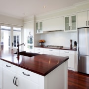 View of a kitchen which features wooden benchtops cabinetry, countertop, cuisine classique, interior design, kitchen, real estate, room, gray, white