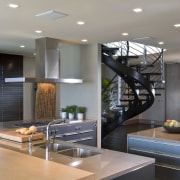 View of contemporary condominium kitchen which features aluminium countertop, interior design, kitchen, gray