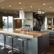 View of contemporary condominium kitchen which features aluminium cabinetry, countertop, cuisine classique, interior design, kitchen, brown