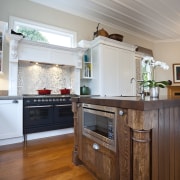 View of a kitchen designed by Nicola Cumming cabinetry, ceiling, countertop, cuisine classique, floor, flooring, hardwood, home, interior design, kitchen, living room, real estate, room, wood, wood flooring, gray, brown