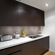 View of a contemporary kitchen manufactured and installed architecture, cabinetry, ceiling, countertop, interior design, kitchen, product design, sink, under cabinet lighting, black, gray