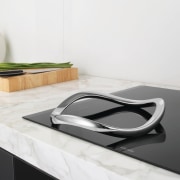 View of the E:Motion trivet from Electrolux which coffee table, floor, furniture, product, product design, sink, table, tap, white