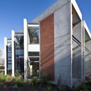 Exterior view of the siding &amp; garden features apartment, architecture, building, commercial building, condominium, corporate headquarters, facade, headquarters, home, house, mixed use, property, real estate, residential area, sky