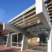 The entrance way of the university - The architecture, building, commercial building, condominium, corporate headquarters, daylighting, daytime, facade, mixed use, real estate, residential area, blue