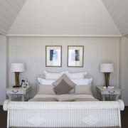 Interior view of a light-toned beach house. - bed frame, bedroom, ceiling, daylighting, estate, floor, furniture, home, interior design, mattress, real estate, room, suite, wall, window, gray