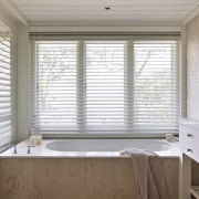 Interior view of a light-toned beach house. - curtain, daylighting, floor, flooring, home, house, interior design, real estate, room, sash window, shade, window, window blind, window covering, window treatment, wood, gray, brown