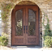 View of the entrance way which features an door, facade, window, wood, white, brown