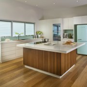 View of contemporary kitchen with light toned benchtops cabinetry, countertop, cuisine classique, floor, flooring, hardwood, interior design, kitchen, laminate flooring, room, wood, wood flooring, gray, brown