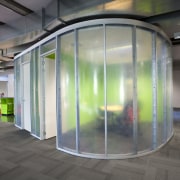 Interior view of this contemporary office features plastic architecture, glass, gray