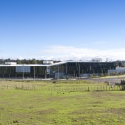 Overview of the exterior - Overview of the architecture, cloud, corporate headquarters, house, land lot, real estate, rural area, shed, sky, structure, teal