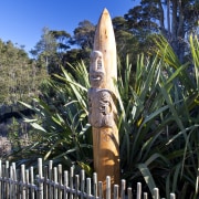 View of the Maori carving within the garden arecales, outdoor structure, plant, tiki, tree, black