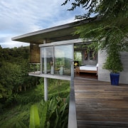 View of deck with bush landscape. - View architecture, backyard, cottage, home, house, outdoor structure, property, real estate, tree